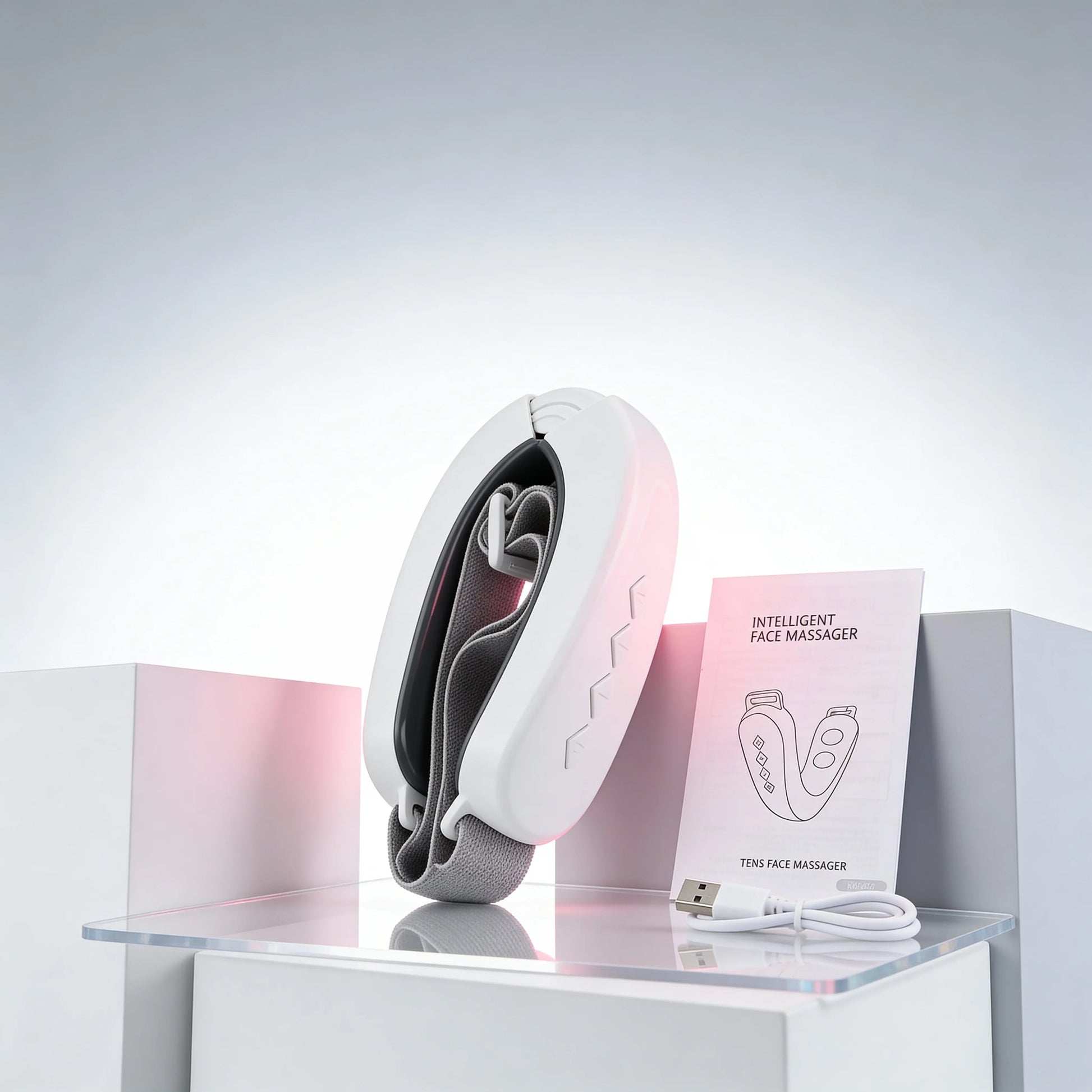 EMS Microcurrent Face Lifting Device by Skinsbliss displayed with USB cable and manual. Ideal for facial toning, anti-aging, and skin rejuvenation.