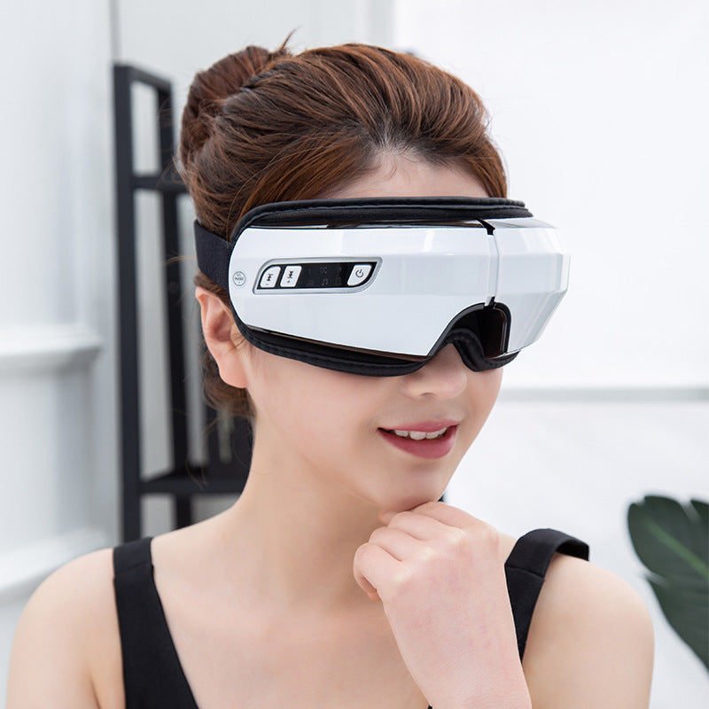 Woman wearing a white and black eye device with a blurred background