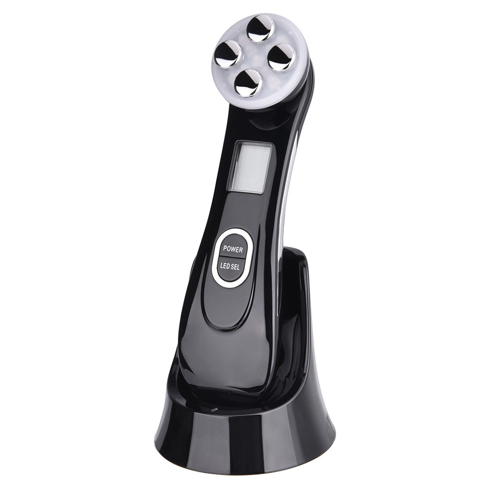 Black handheld electronic device with digital display on a white background