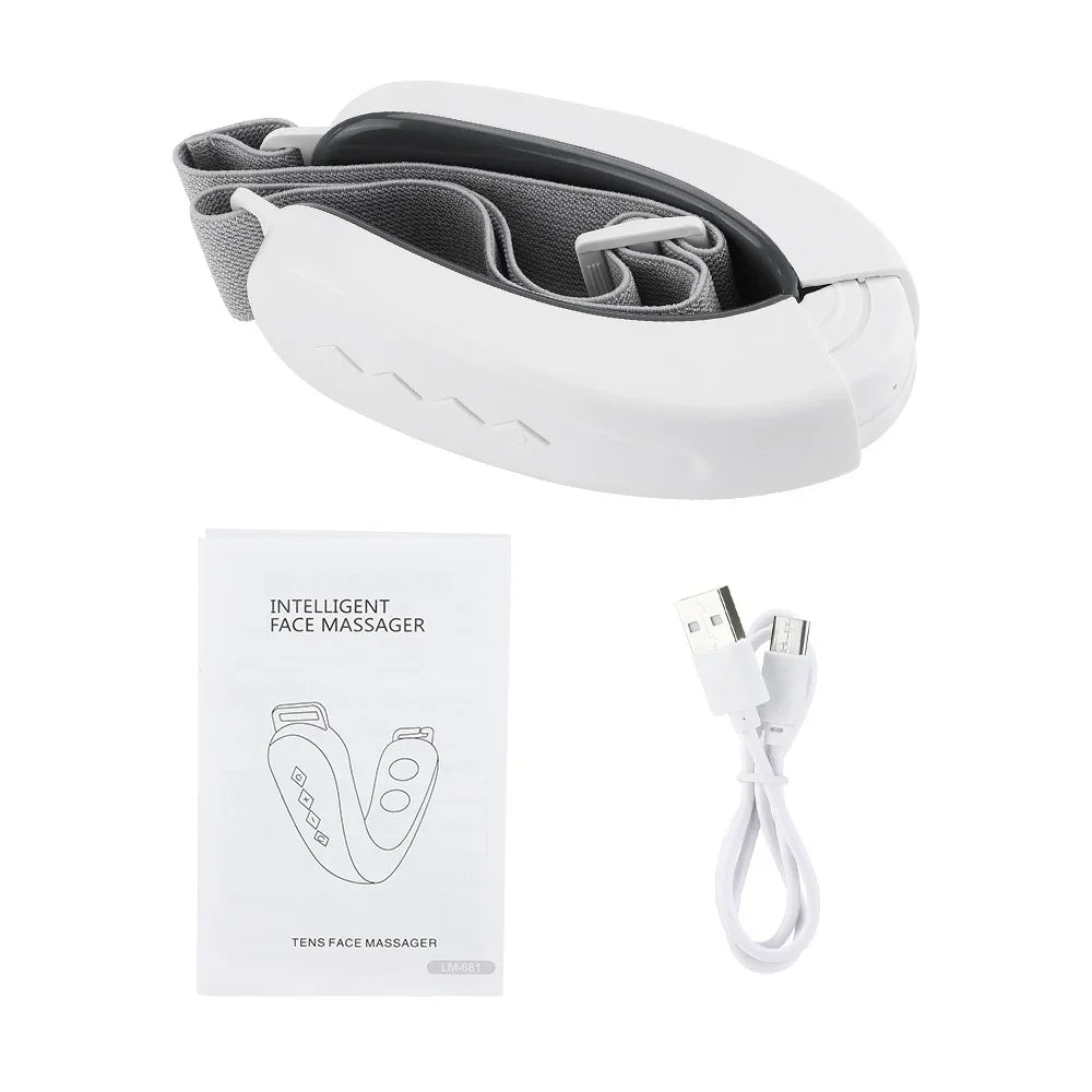 White face massager with packaging, cable, and manual on a white background