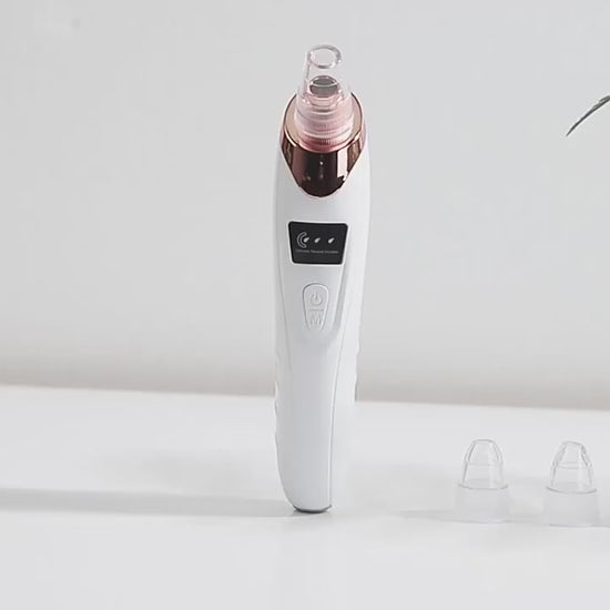 Electric Pore Cleaner - 5-Head Blackhead Vacuum Device by Skinsbliss shown with detachable suction heads. Ideal for deep pore cleansing and facial care.